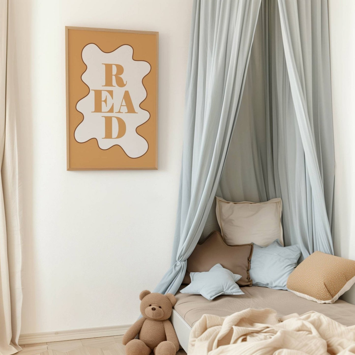Children's reading nook with pillows, teddy bear, and 'READ' sign on wall.