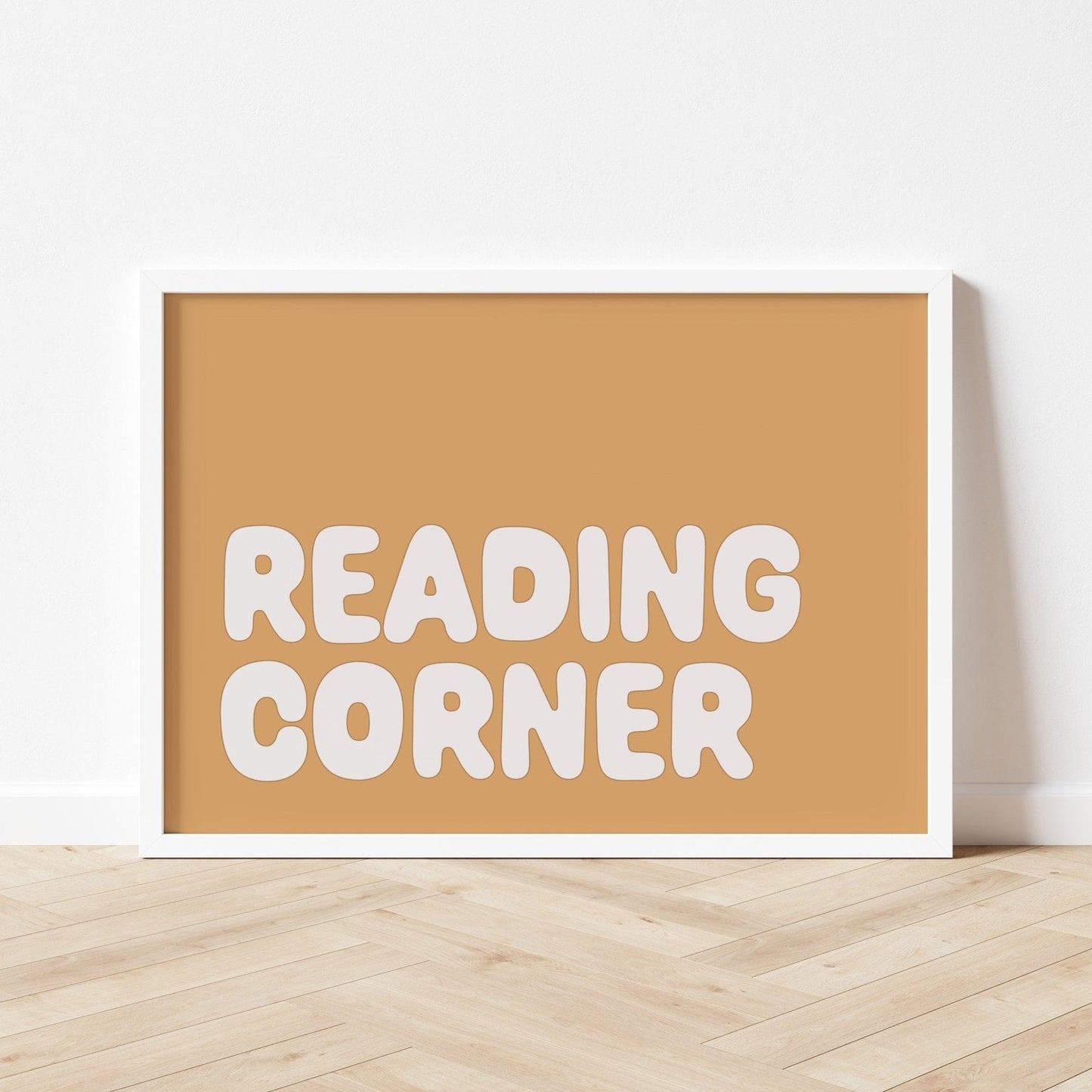 Framed sign with 'READING CORNER' text on a beige background