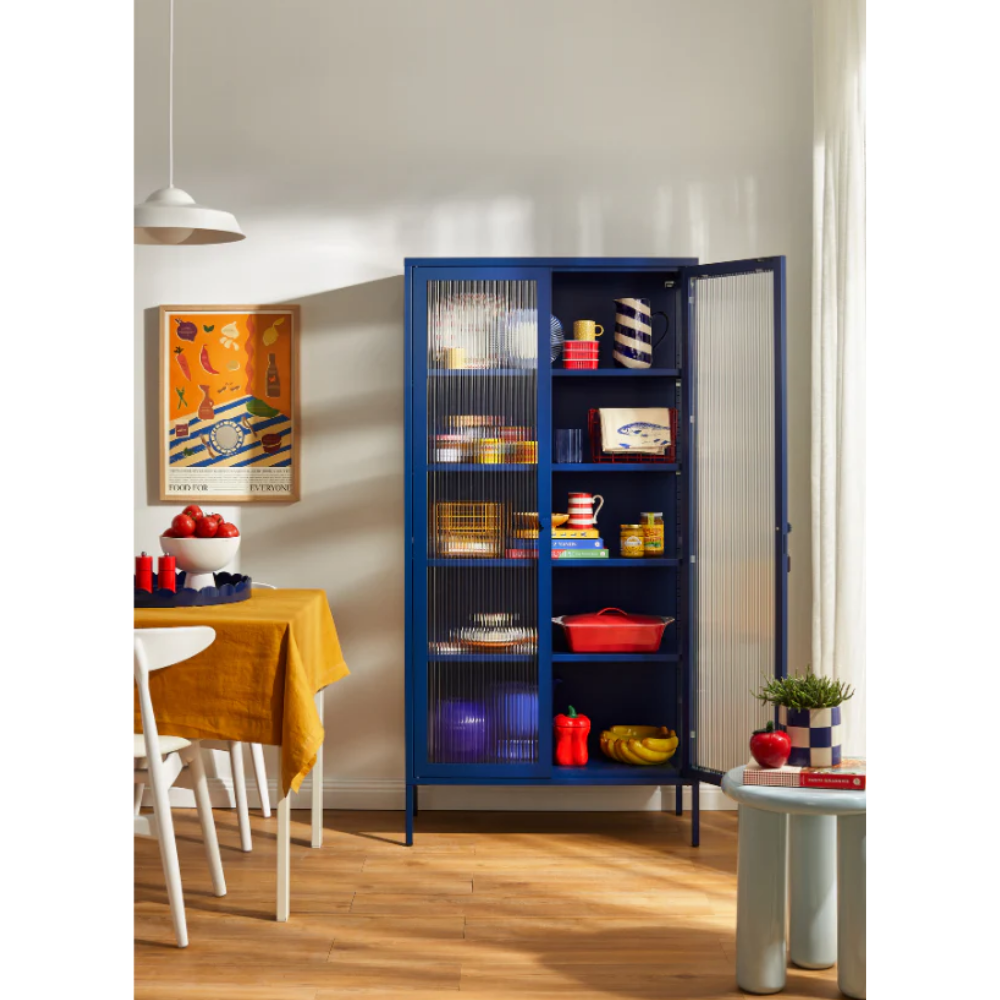 Navy blue cabinet with glass panel in a dining room