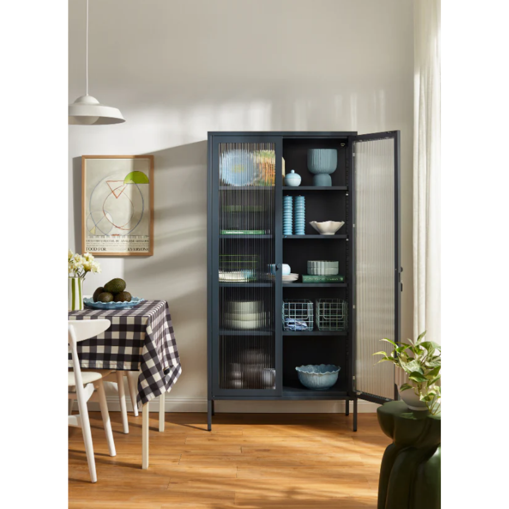 Navy cabinet with glass panels in a dining room setting