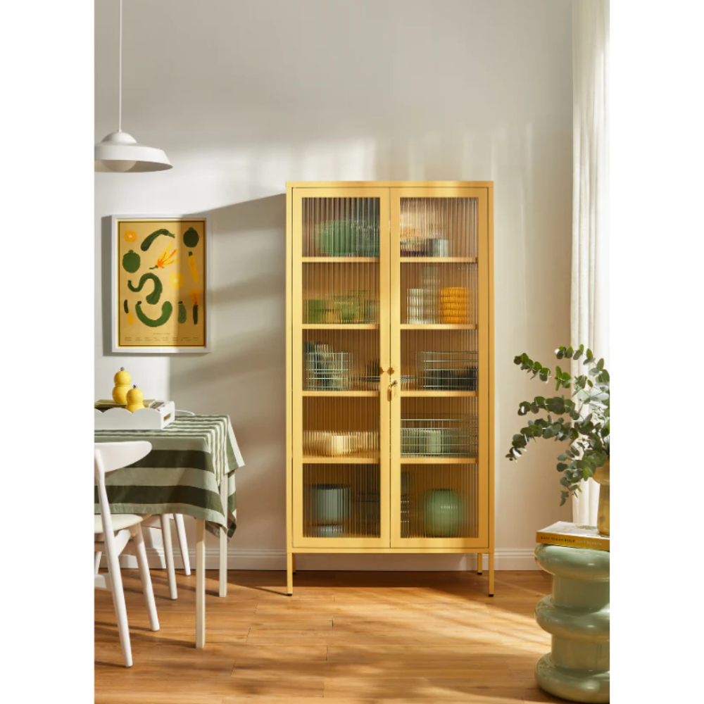 Glass panel mustard cabinet in dining room