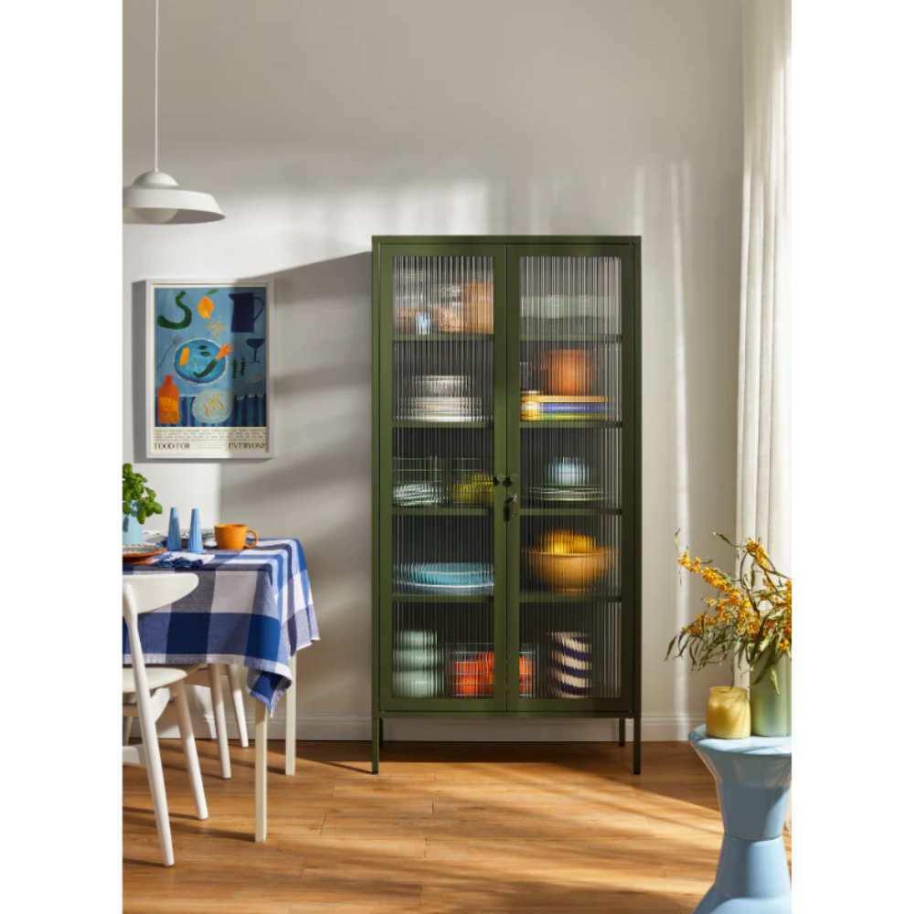 Green olive cabinet in a dining room area