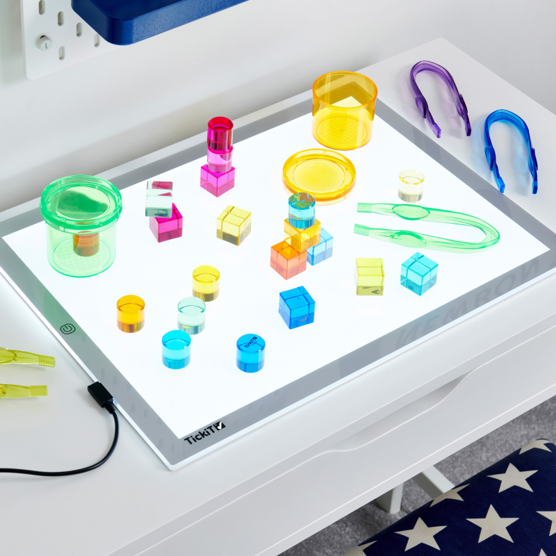 Colourful geometric shapes on a light-up panel with a white background