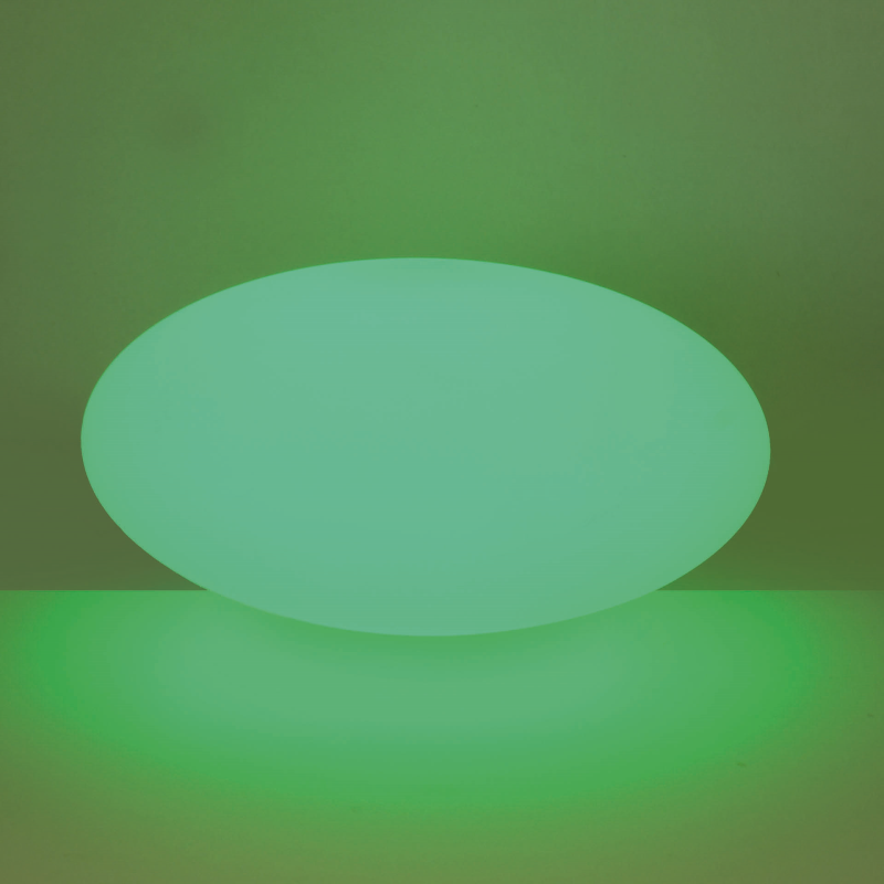 Green glowing oval shape on a green background