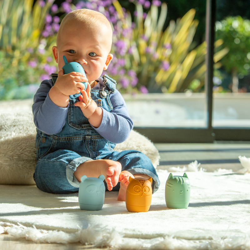 Baby playing with colourfu silicone toys