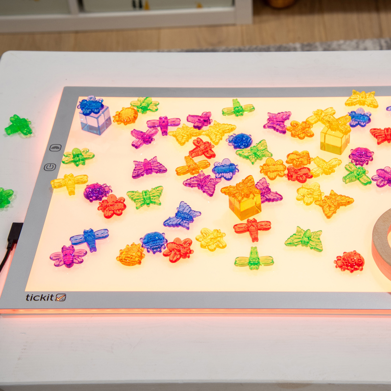 colourful plastic figures on a light up panel