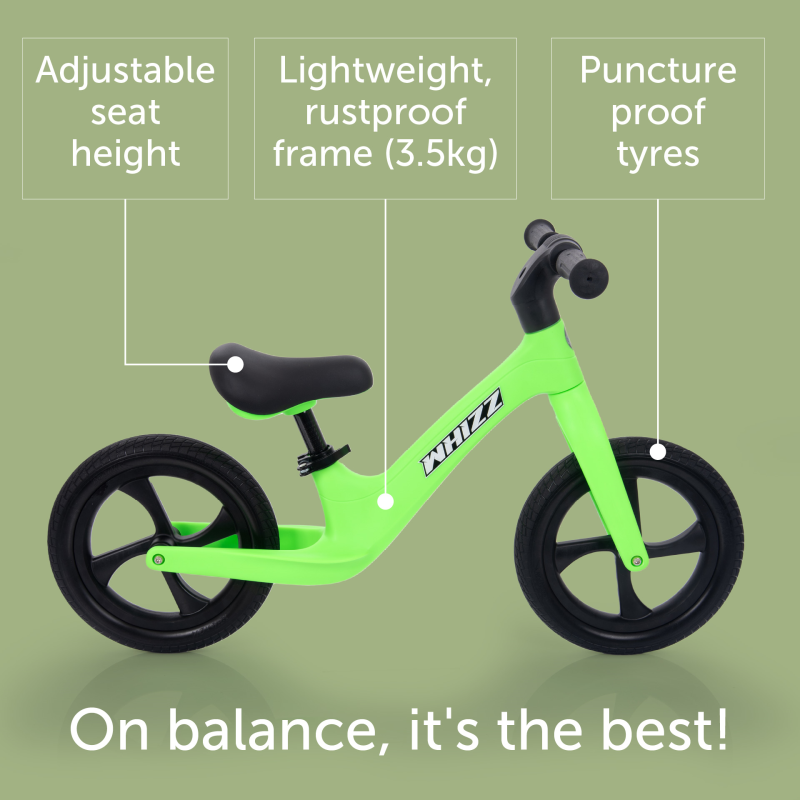 Green balance bike with features highlighted on a green background