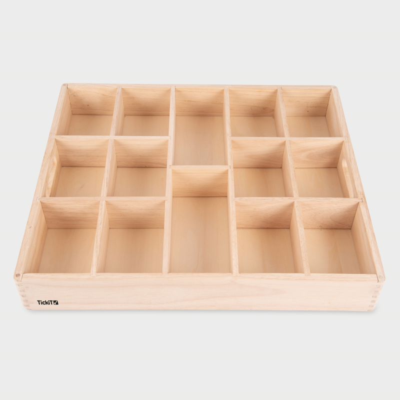 Wooden compartmentalized tray on a light gray background