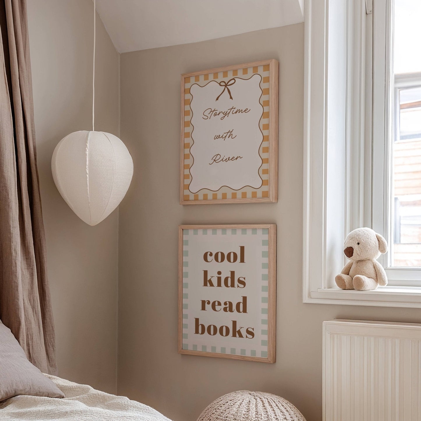 Children's room with framed quotes on the wall and a teddy bear by the window.
