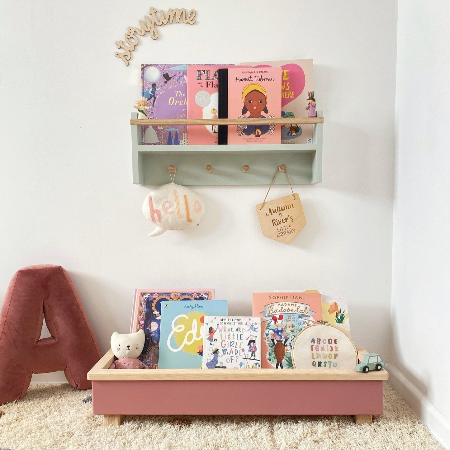 Children's room with shelves displaying books and toys on a carpeted floor.