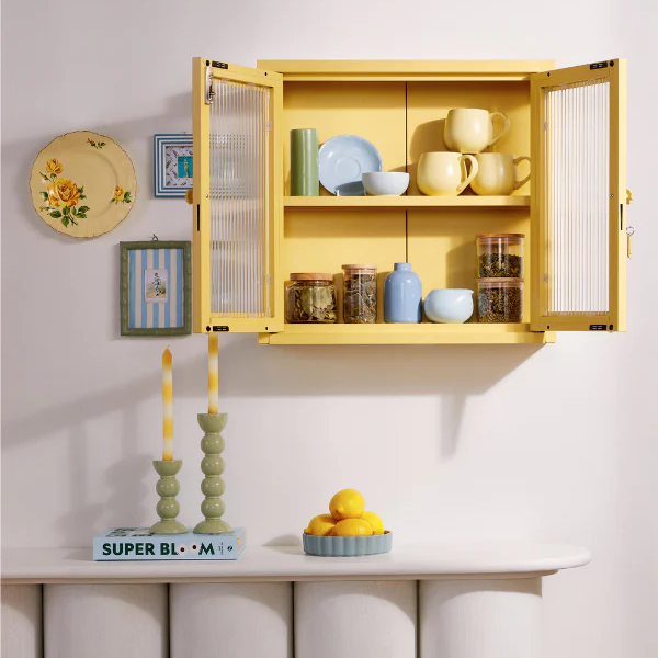 Cabinet open with tea and coffee cups inside