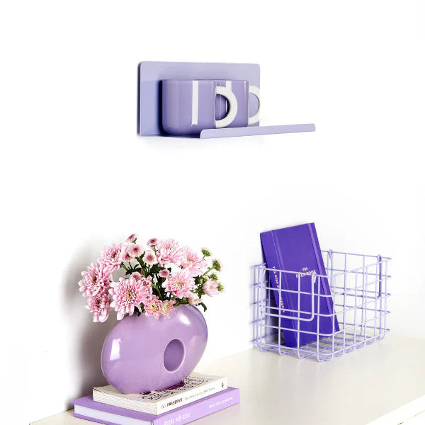 Lilac shelf on wall with light purple decor