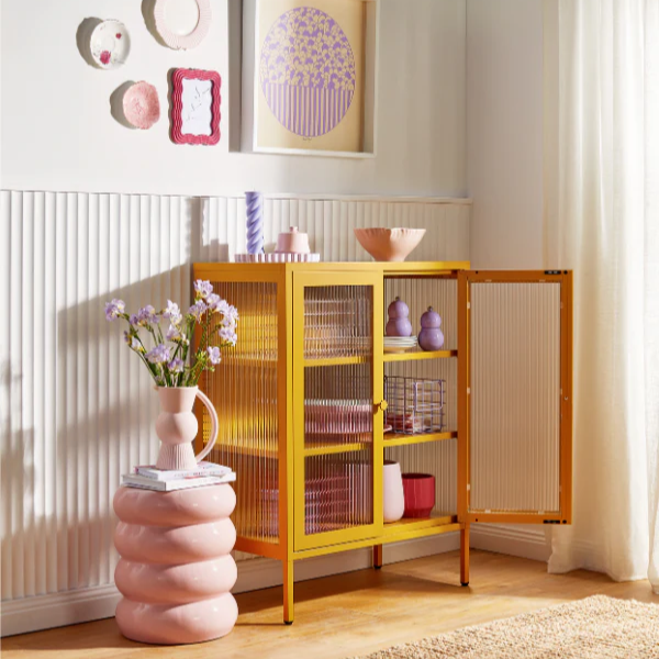 Cabinet in a home environment with a flower