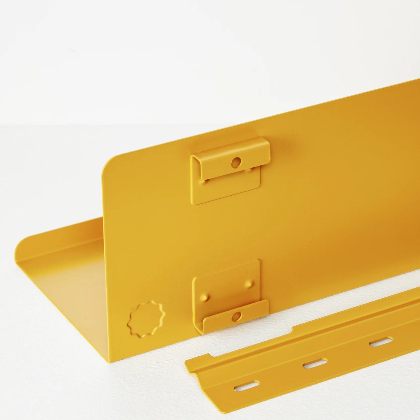 Yellow metal bracket on a white background