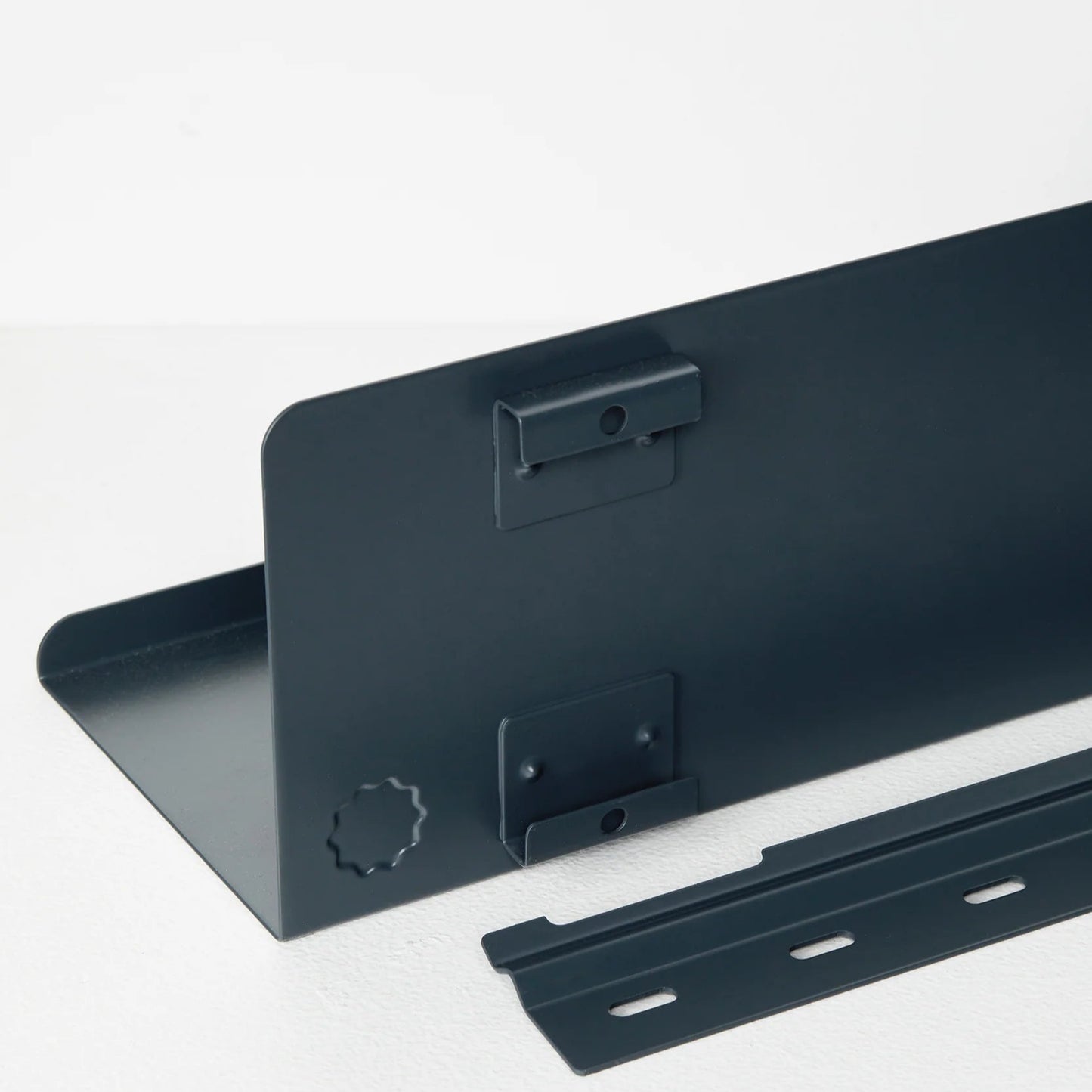 Black metal brackets on a white background