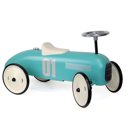Blue ride on toy car on white background