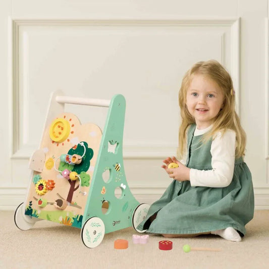 Child playing with a wooden toy in a bright room