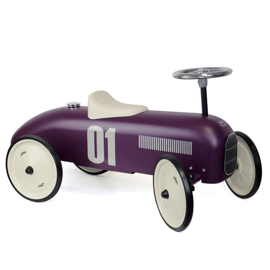 Purple classic ride on car toy on white background