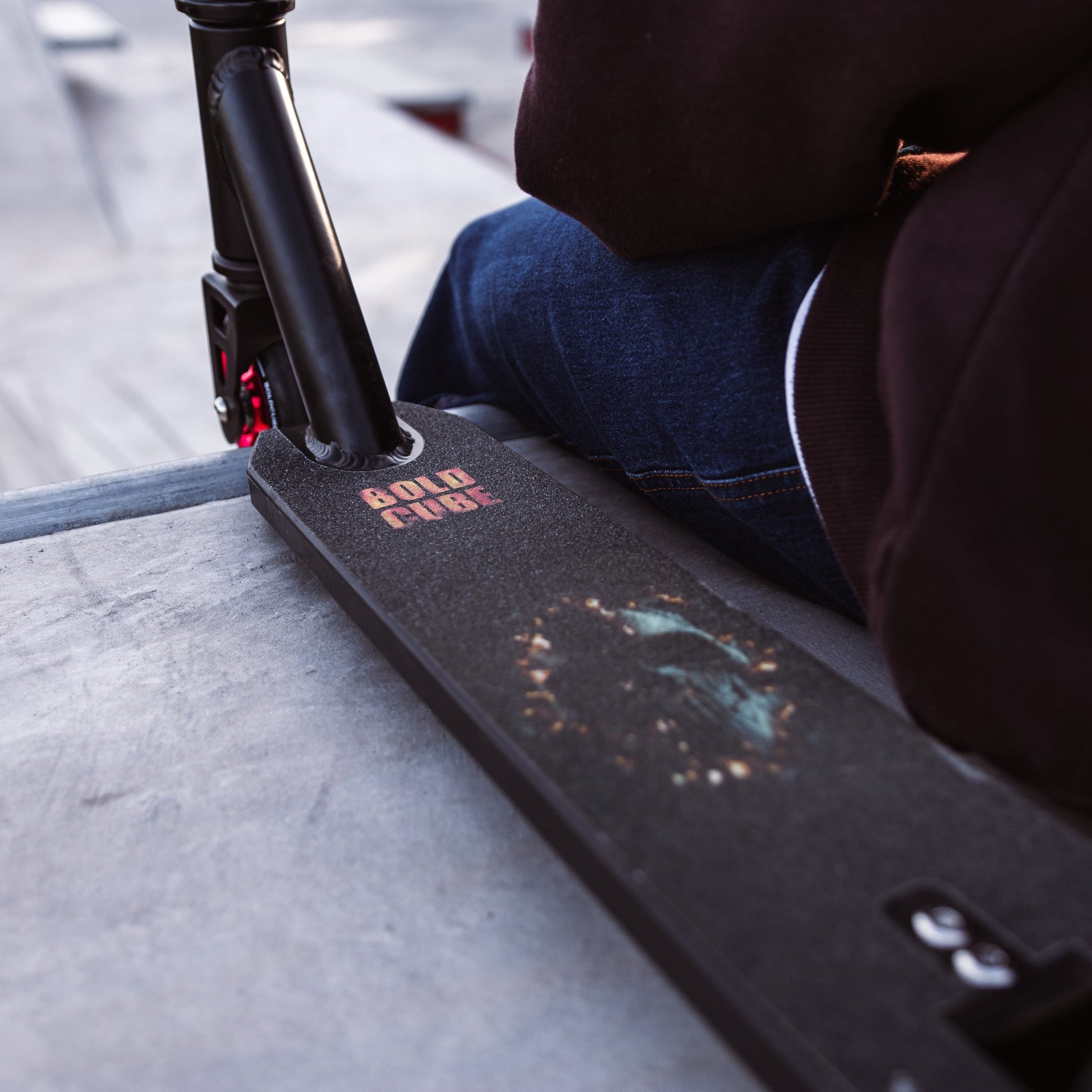 Close-up of a skateboard with 'Bolt' branding on a concrete surface.