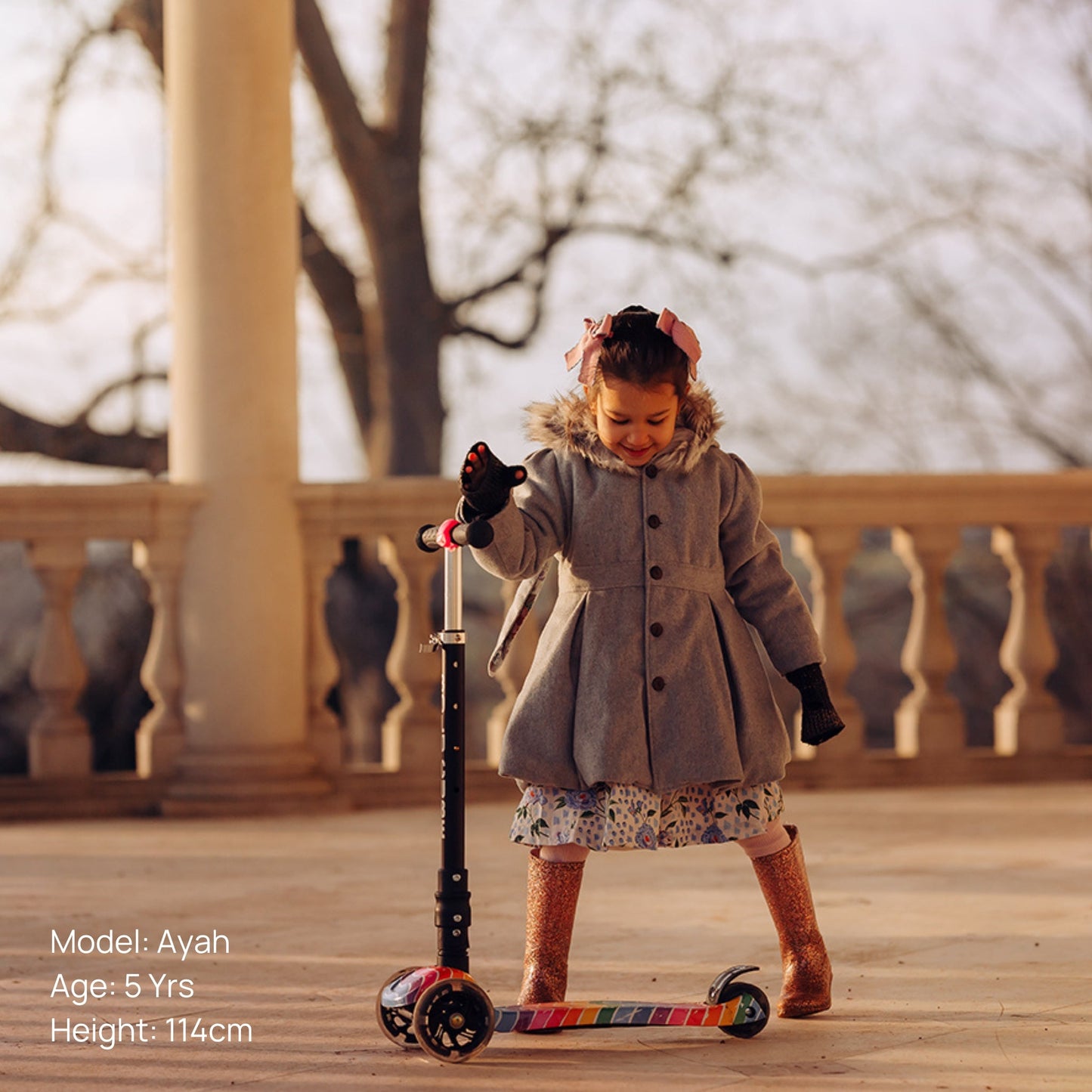 Young girl on a scooter with a blurred background
