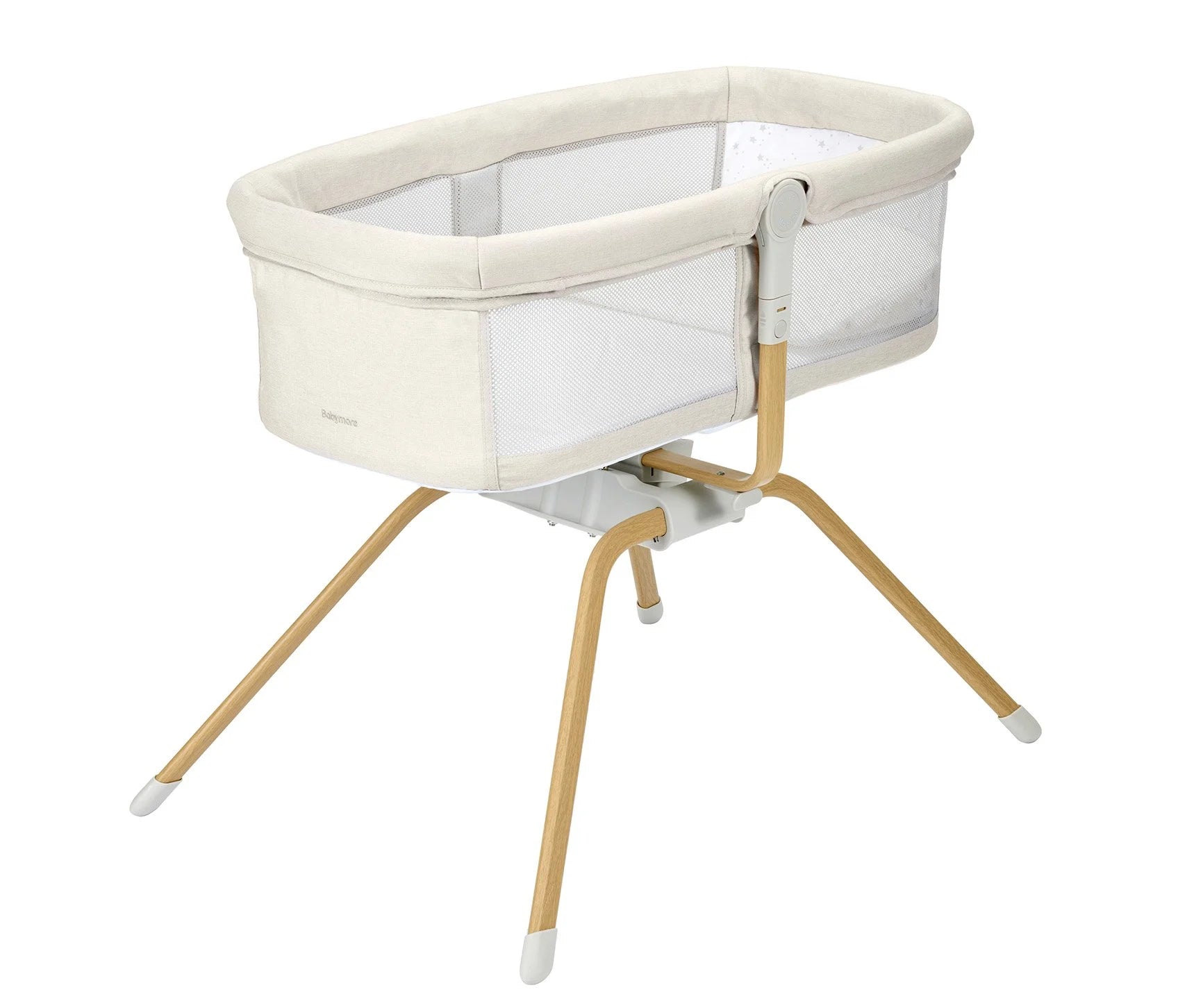 Baby crib with beige fabric and wooden legs on a white background