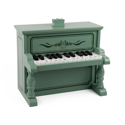 Green toy piano with white and black keys on a white background