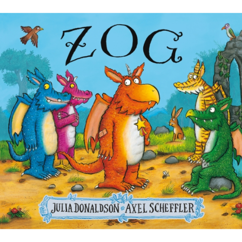 Book cover of 'Zog' featuring colorful dragons and a rabbit in a forest setting.