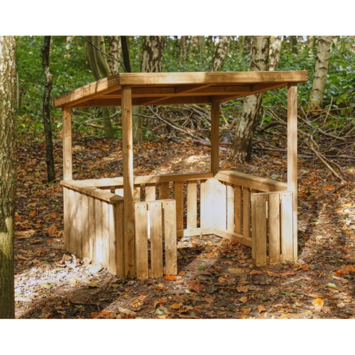 Wooden gazebo in a forest setting