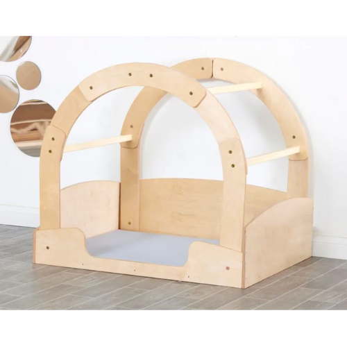 Wooden playhouse with a dome-shaped roof on a tiled floor.