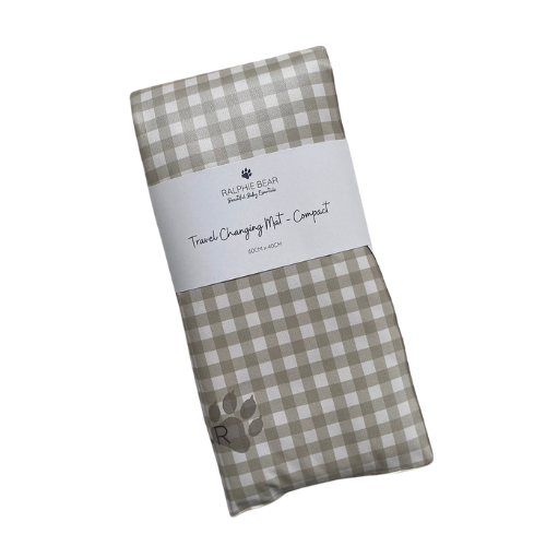 Folded checkered changing mat with a label on a white background