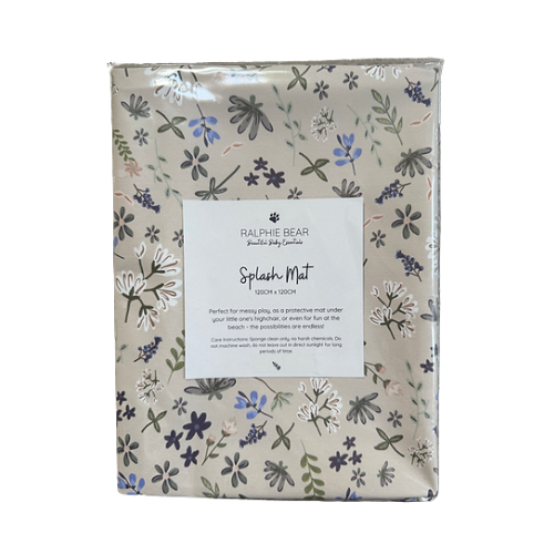 Packaged splash mat with floral pattern and Ralphie Bear branding on a white background