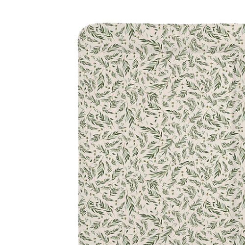 Fabric swatch with green leaf pattern on a beige background