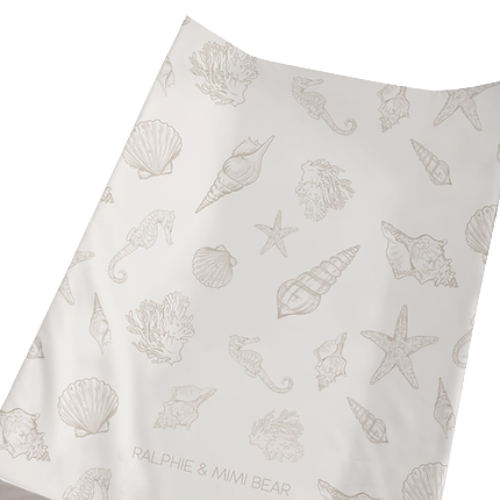 Fabric with shell pattern and 'Ralphie & Mimi Bear' branding on a white background