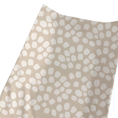 Beige fabric with white abstract pattern on a beige background
