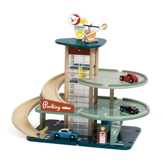 Toy parking garage set with cars on a white background