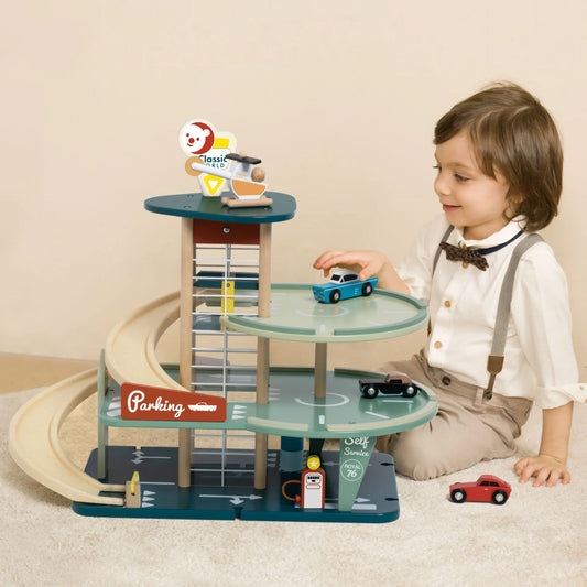 Child playing with a toy car track set on a beige carpet.