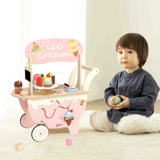 Child playing with a pink toy ice cream cart on a light-colored floor.