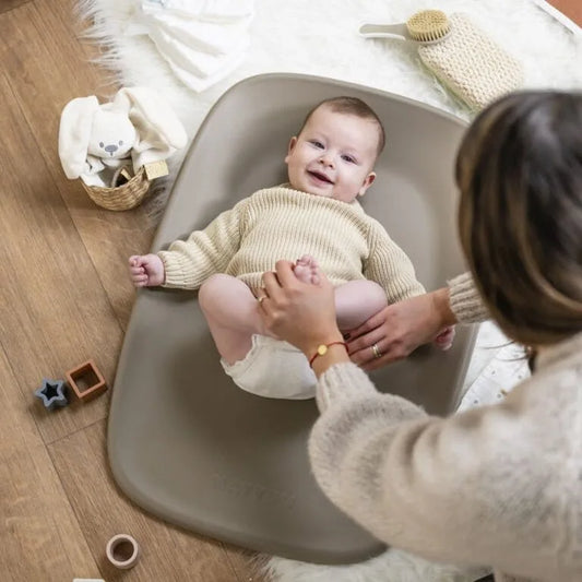 Baby on a changing mat