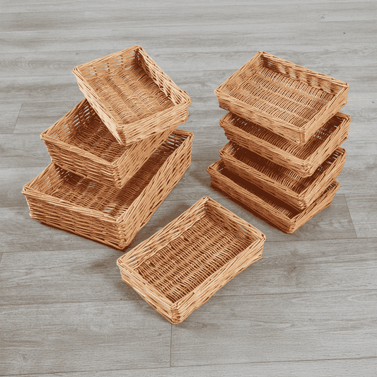 Set of wicker baskets on a wooden surface