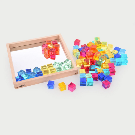 Colorful transparent cubes with a wooden frame on a white background