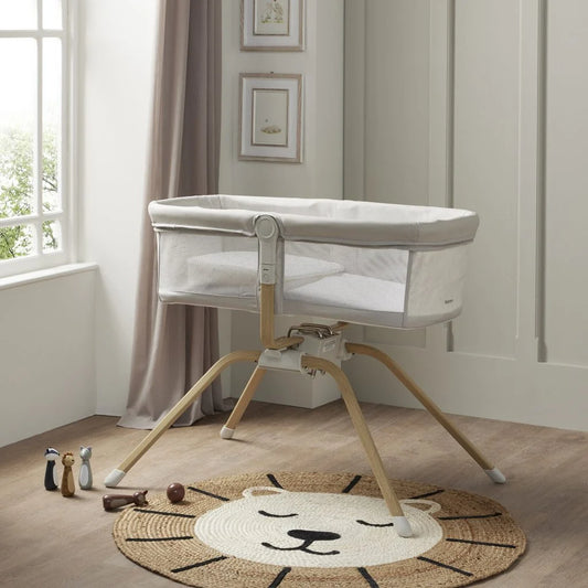 Baby crib in a room with a window and decorative elements