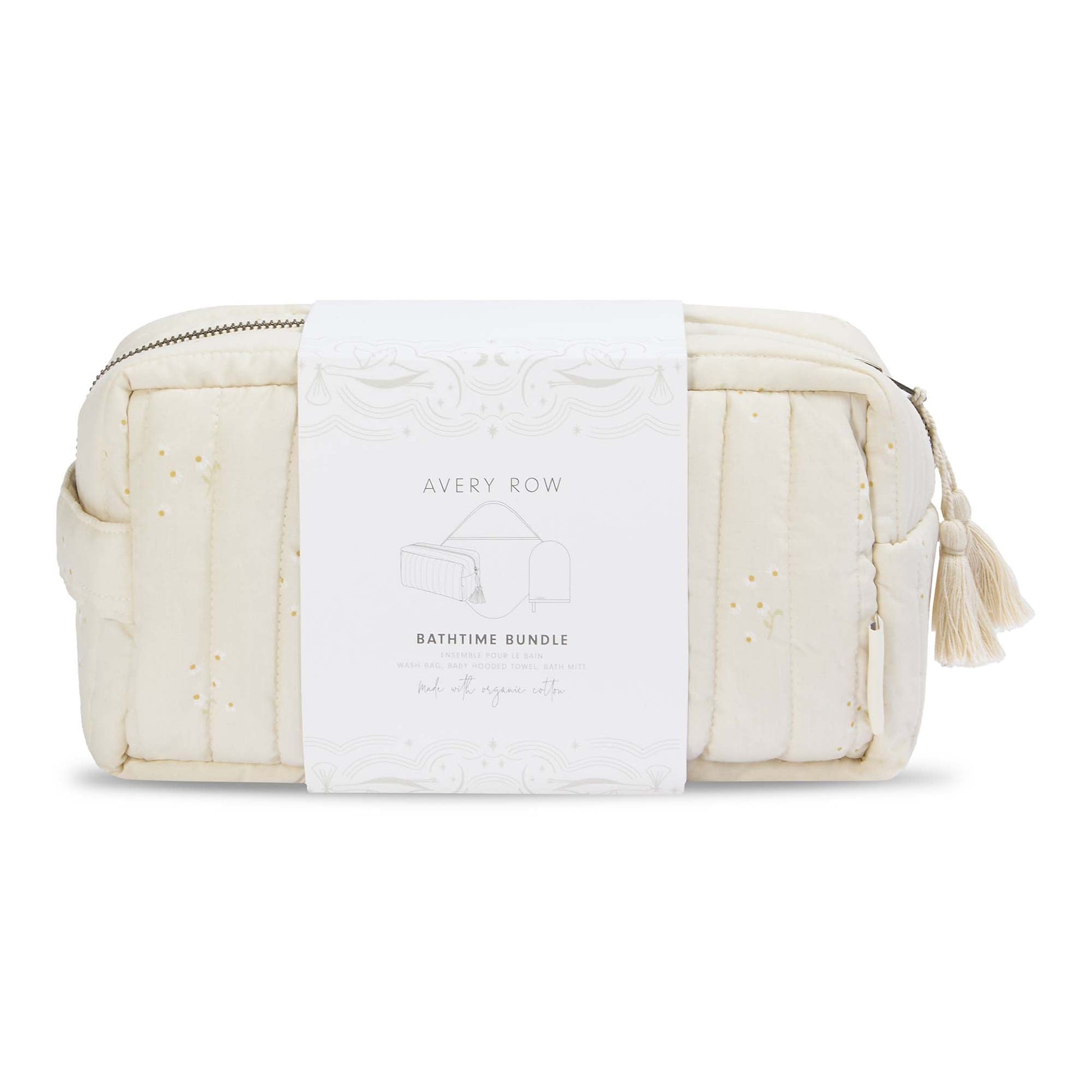White quilted toiletry bag with tassel on a white background, featuring 'Avery Row' branding.