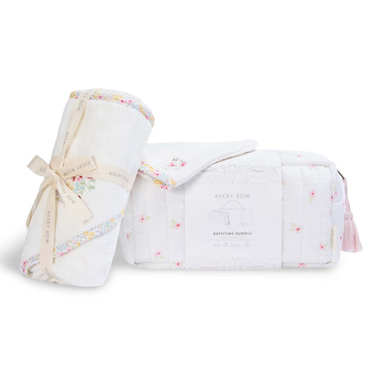 Baby swaddle and muslin blanket set with floral pattern on a white background