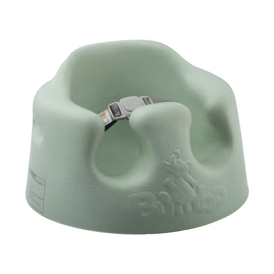 Light green baby seat with 'Bumbo' branding on a white background