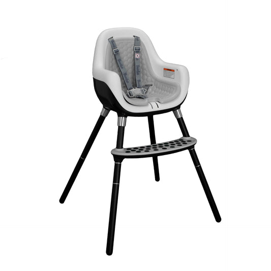 Black and white high chair with safety harness on a white background
