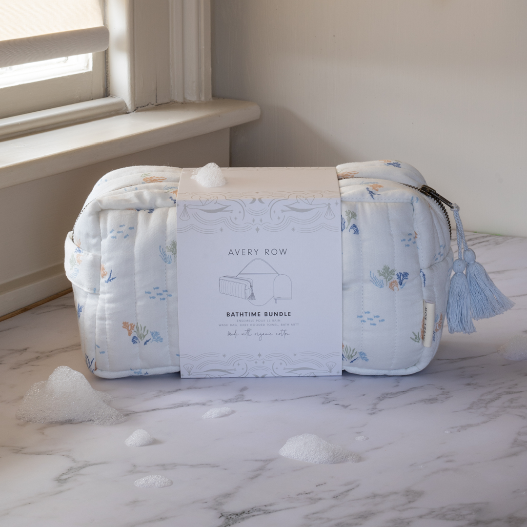 Bathtime bundle with towels and a box labeled 'Avery Row' on a marble surface.