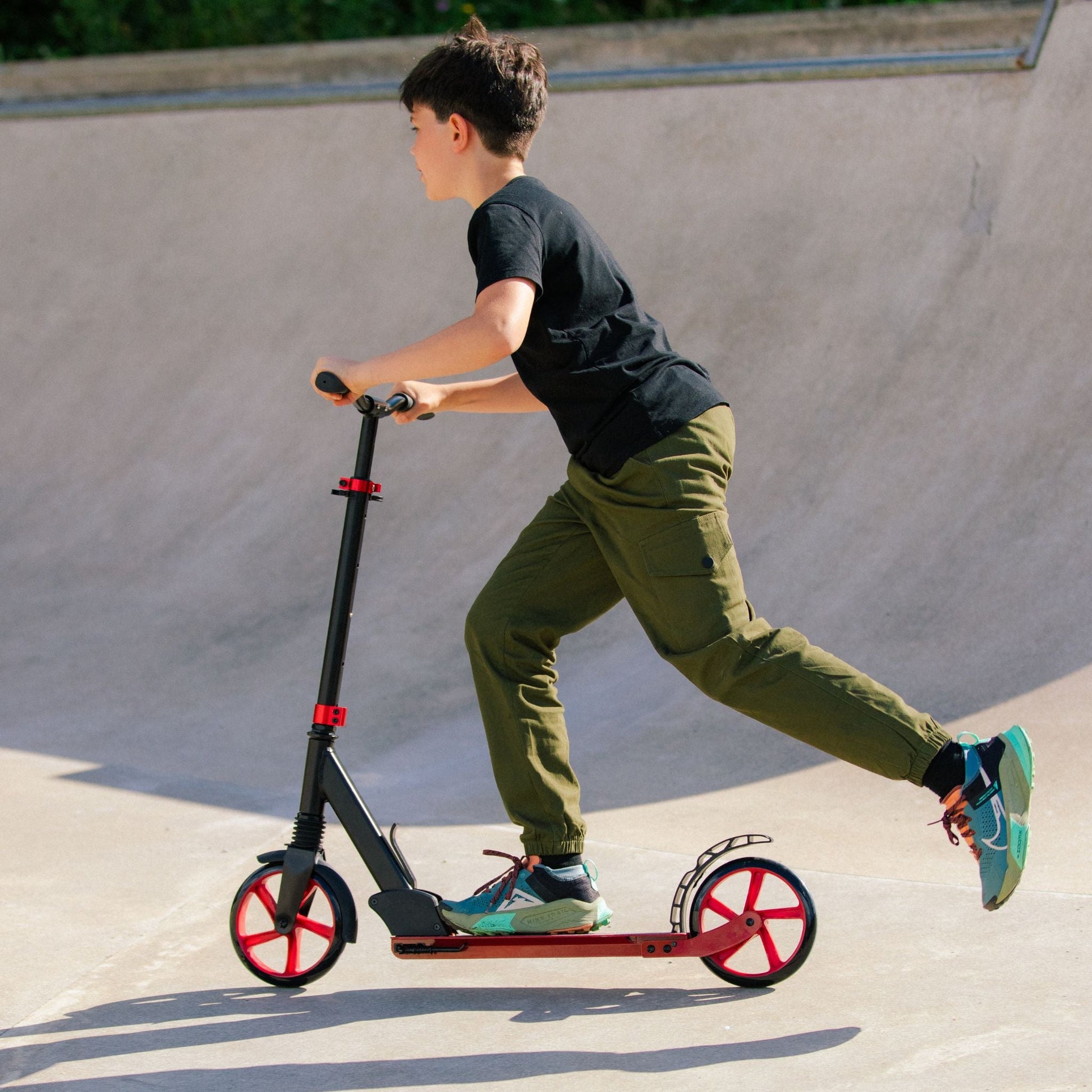 Person riding a scooter at a skate park