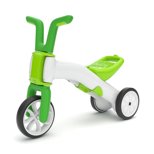 Green and white children's tricycle on a white background