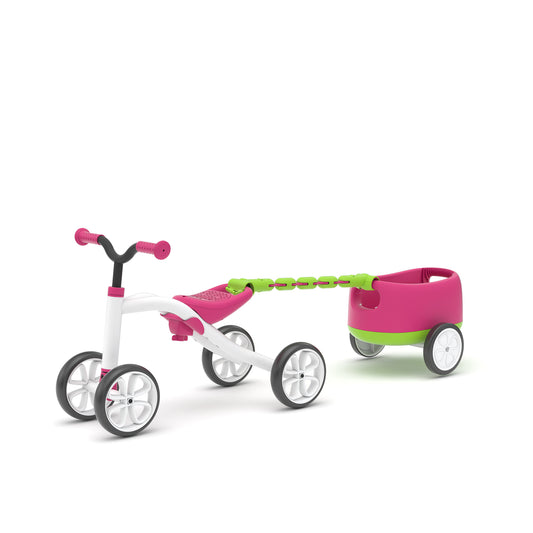 Children's tricycle with a pink and green trailer on a white background