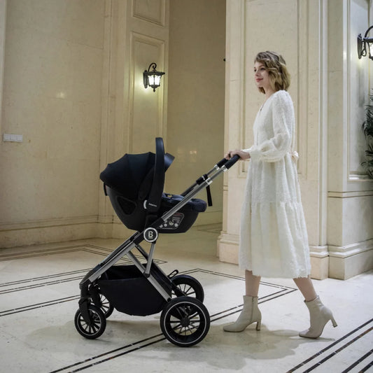 Woman pushing a black stroller in an elegant interior setting